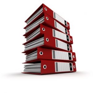 Pile of red ring binders